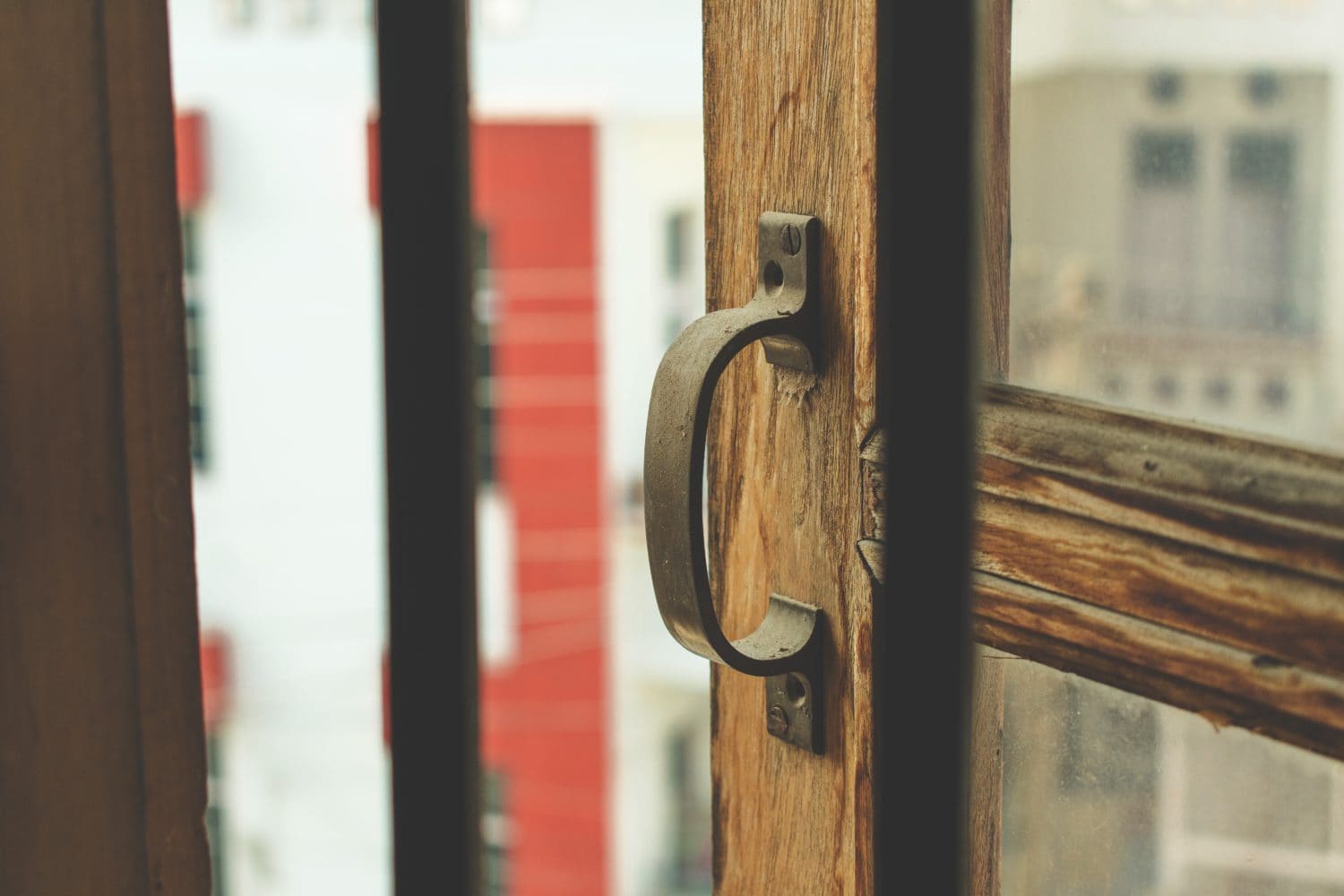 Brass handle on a push to open door