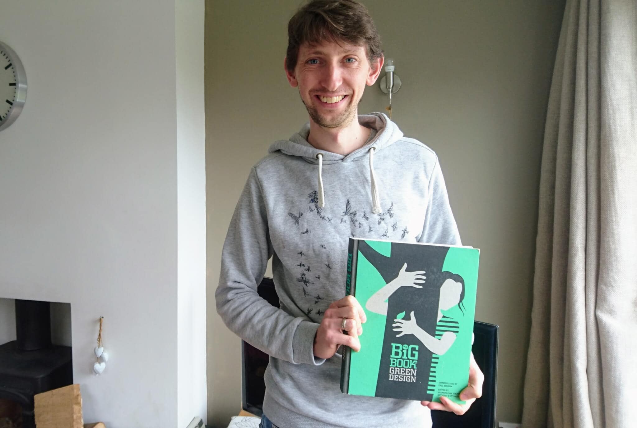 Tom holding the Big Book of Green Design