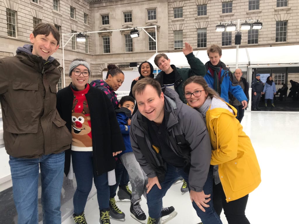 Image of team members having fun at a team day ice skating at Somerset House