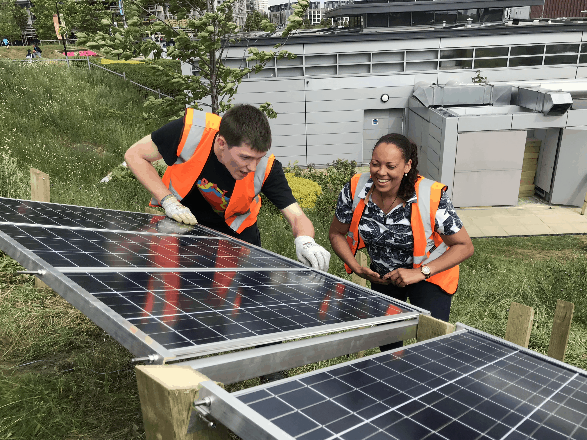 image of jerome and rachael installing solar panels