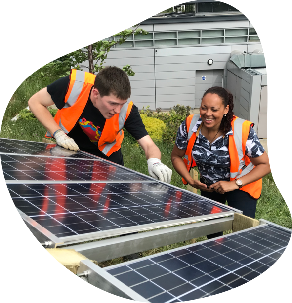 image of rachael and jerome building solar panels