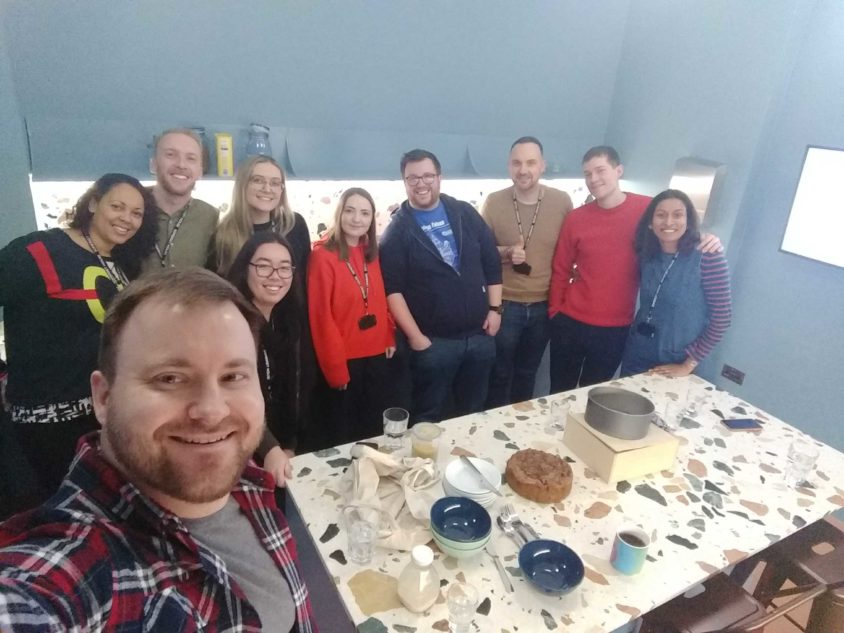 Picture of wholegrain team celebrating a birthday with cake
