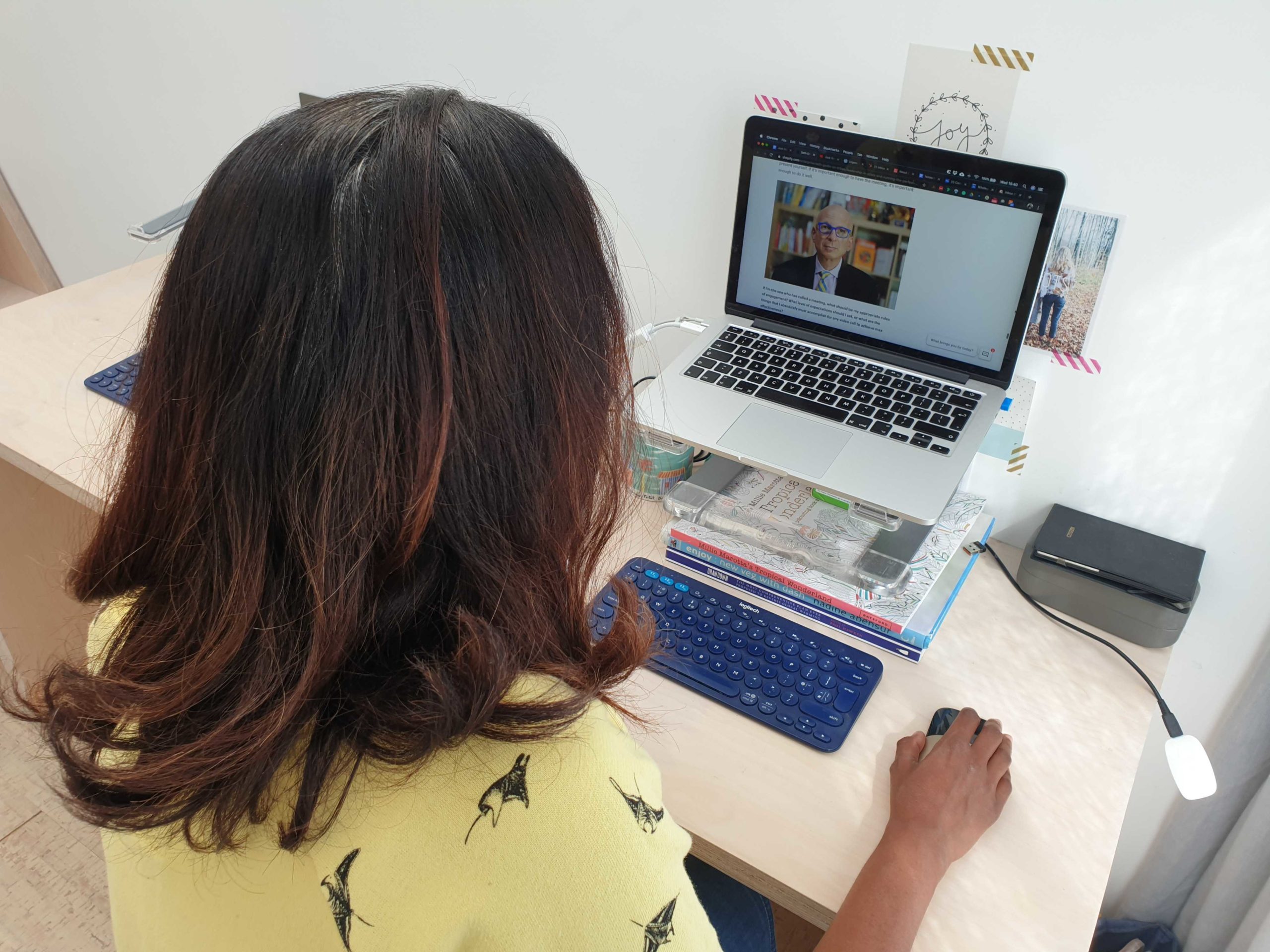 Vineeta working on her laptop at home