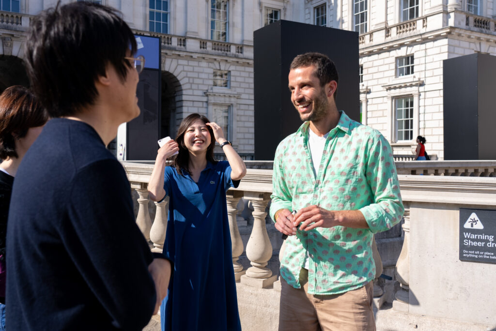 Team Coach Chris shows the team from Harch (Japan) and their guests around Somerset House as part of the Beyond Circularity 2023 tour