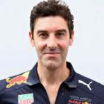 Man wearing red bull racing shirt