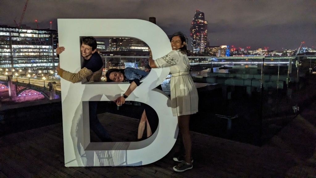 Vineeta, Georgie and Tom hugging the letter B