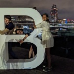 Vineeta, Georgie and Tom hugging the letter B