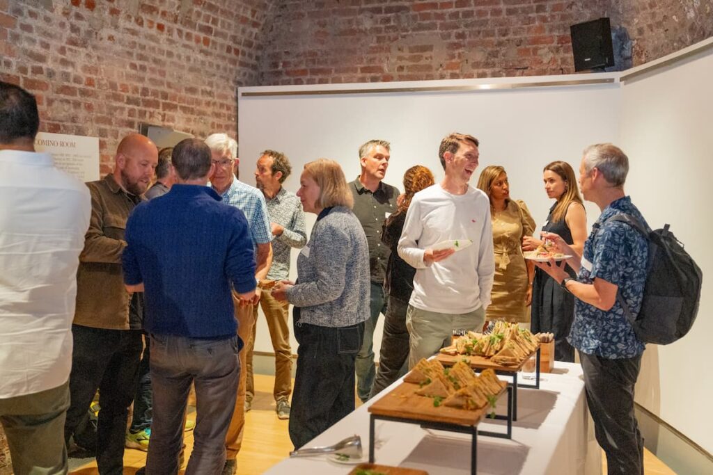 Photo of attendees enjoying mingling over lunch